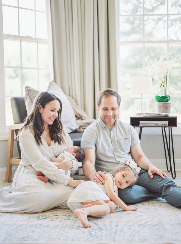 newborn session tips, what to wear to your newborn session, family of four cuddling in living room