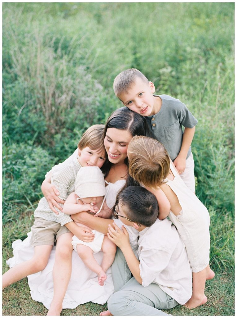 Grace Paul being hugged by children